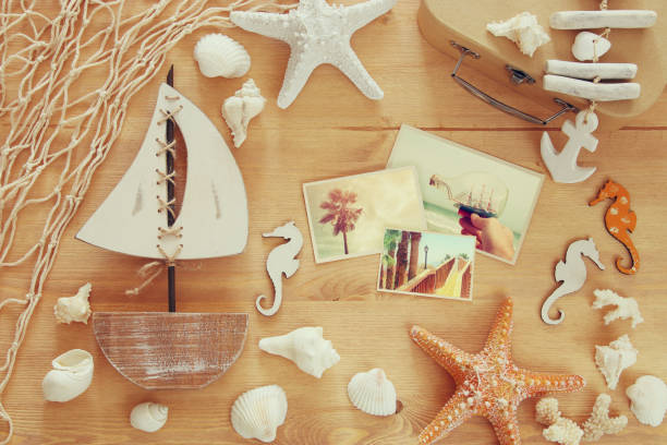 istock Nautical concept with sea life style objects on wooden table. 814449806