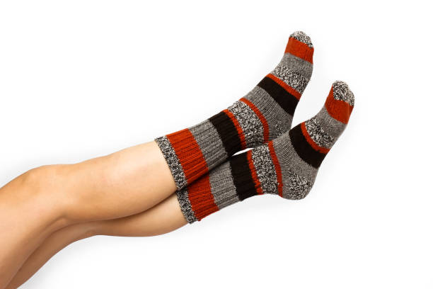 istock Beautiful female legs in colourful socks 814454288