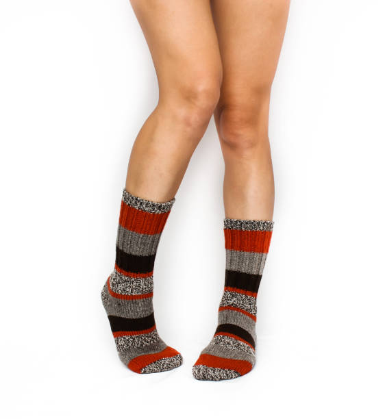 istock Beautiful female legs in colourful socks 814454402