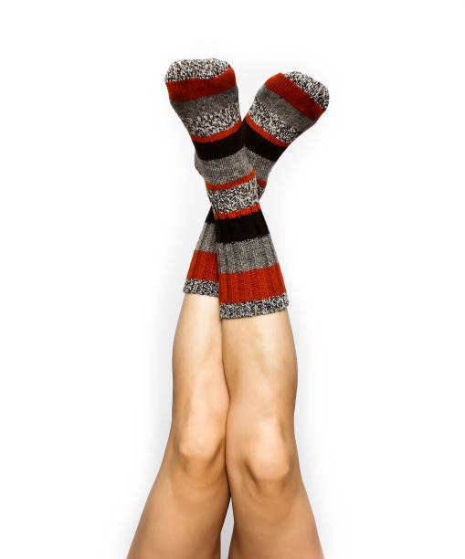 istock Beautiful female legs in colourful socks 814454474