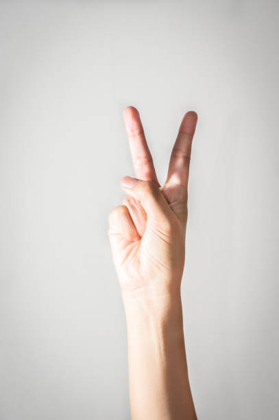 istock Girl hand with two fingers up. 814468350
