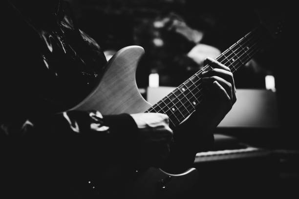 istock male musician playing electric guitar in studio 814468512