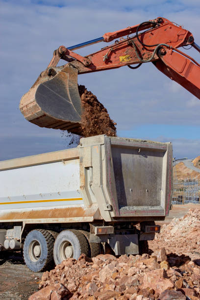 istock Bulldozer loading sand into the truck 814468576