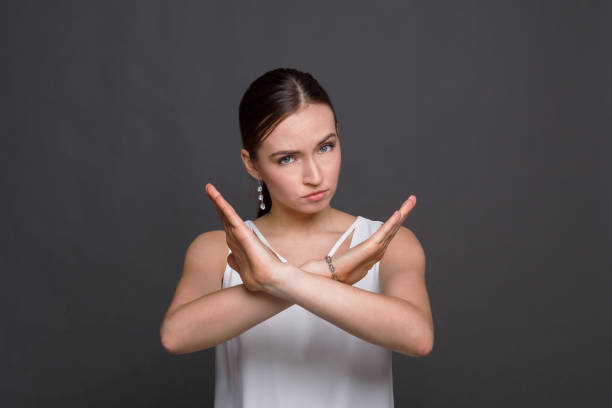 istock Woman making stop sign with crossed hands 814468612