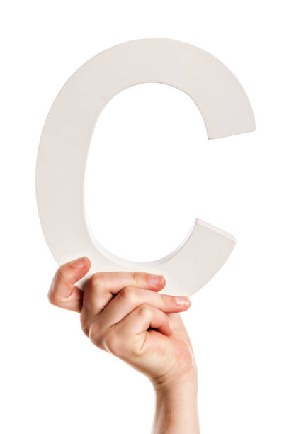 istock Female hand holds up 3-D capital letter C 814468664
