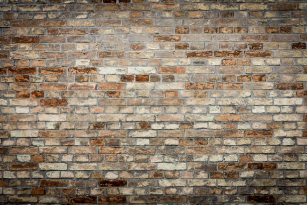 istock Old red brick wall texture grunge background with vignetted corners 814471478