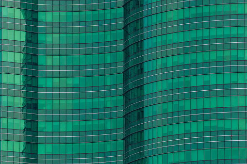 Green modern glass of windows of skyscraper
