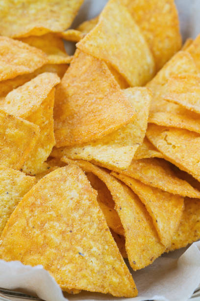 istock tortilla chips in basket on wooden surface 814489620