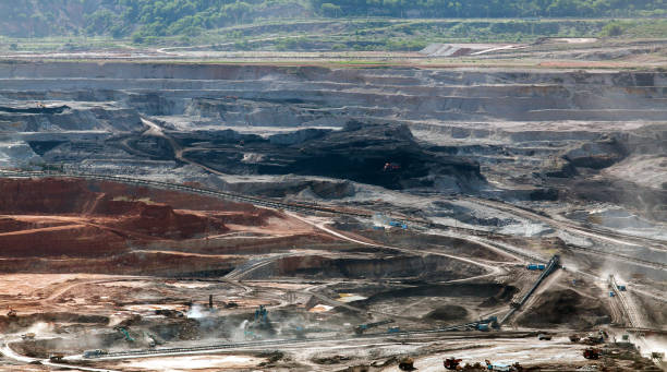 istock Part of a pit with big mining truck working 814489982