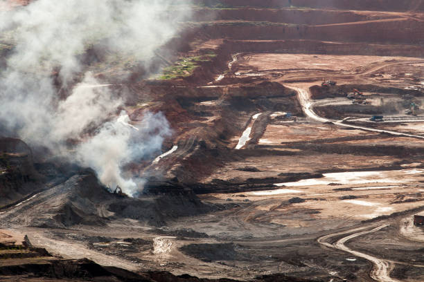 istock Part of a pit with big mining truck working 814489984