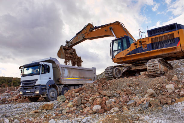 istock Bulldozer loading sand into the truck 814490152