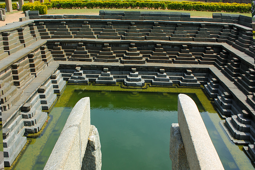 Ancient bathing pond, - a swimming pool a UNESCO heritage site in Hampi, India