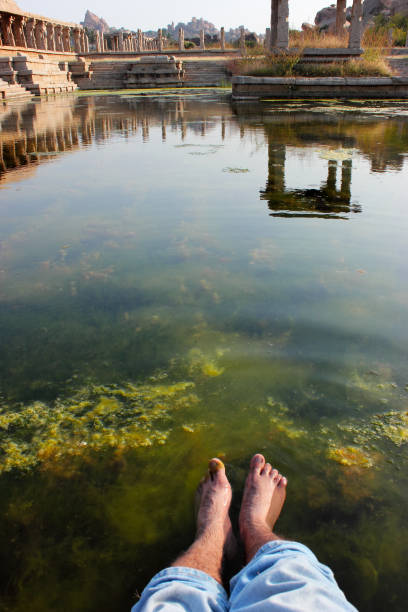 istock Peace of mind - relaxing at ancient pool in Hampi, India 814496672