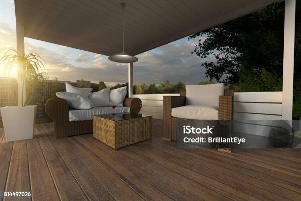 3d Rendering Of Rattan Garden Furniture On Wooden Patio At Garden In The Evening Sunshine Stock Photo - Download Image Now