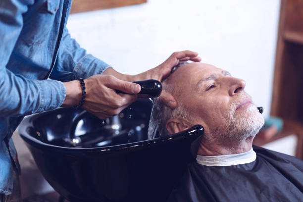 istock Nice senior man visiting a barbershop 814506016