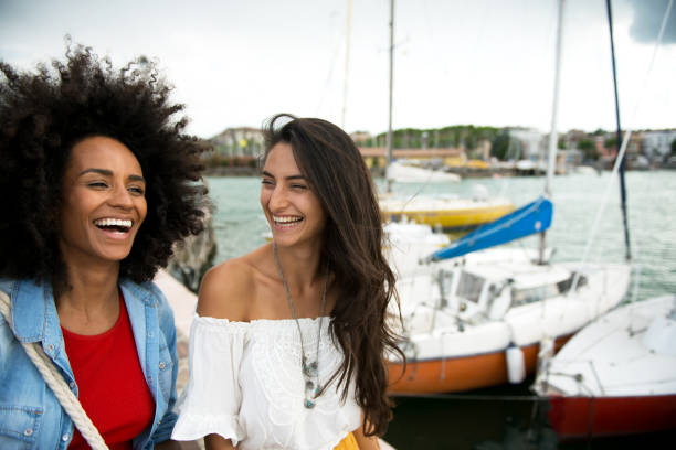 istock Two happy woman friends laughing 814510640