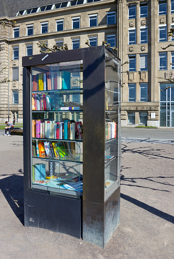Dusseldorf, Germany - May 5, 2016: Free library book case on the Rhine promenade
