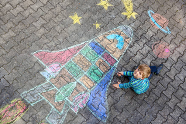 istock little kid boy flying by a space shuttle chalks picture 814519720