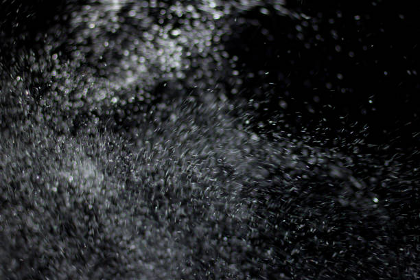 istock Snowstorm texture. Bokeh lights and Falling snow on a black background 814524102