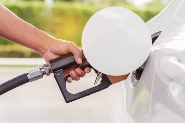 istock hand is holding the fuel tank. 814524850
