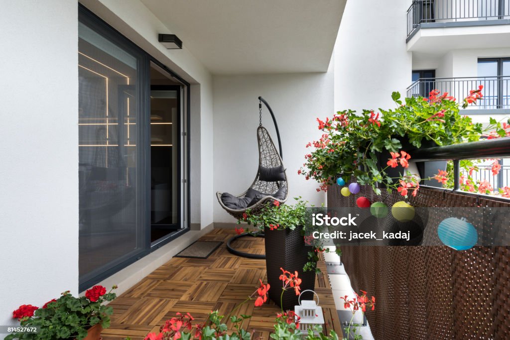 Home terrace Home terrace with wooden floor and chair Balcony Stock Photo
