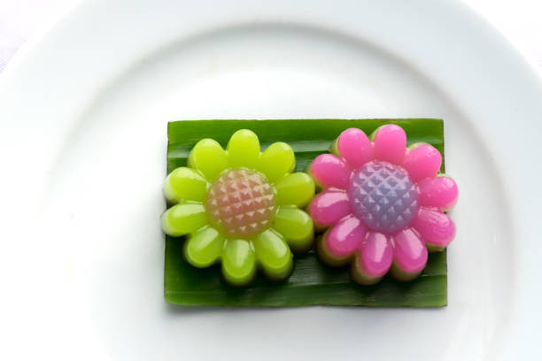 istock Bright flower Layer Sweet Cakes (Kanom Chan) on banana leaf 814528398