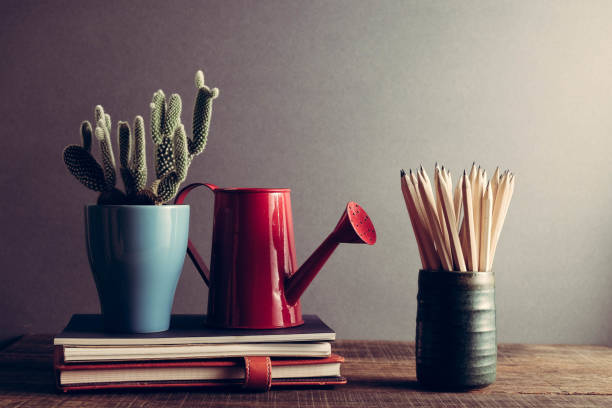 istock Concept of education pencil and book on table with filter effect retro vintage style 814541498