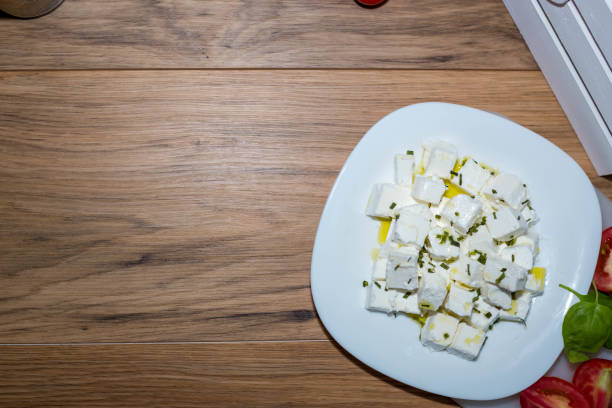 istock Fresh Feta Cheese (detailed close-up shot) on vintage background 814558342