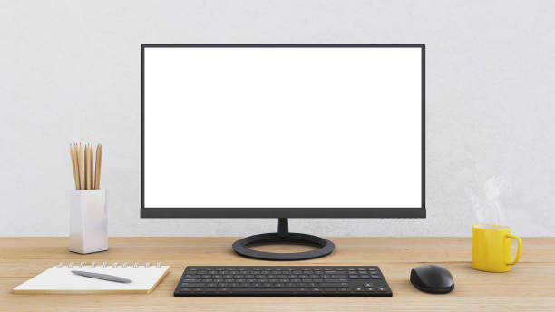 istock Computer monitor on an office desk with equipment 814564470