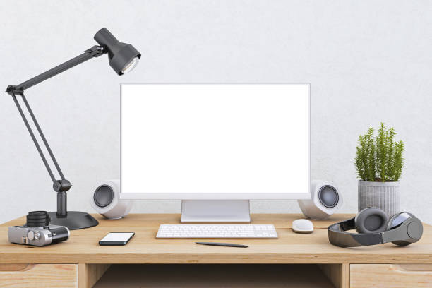 istock Computer monitor on an office desk with equipment 814564530