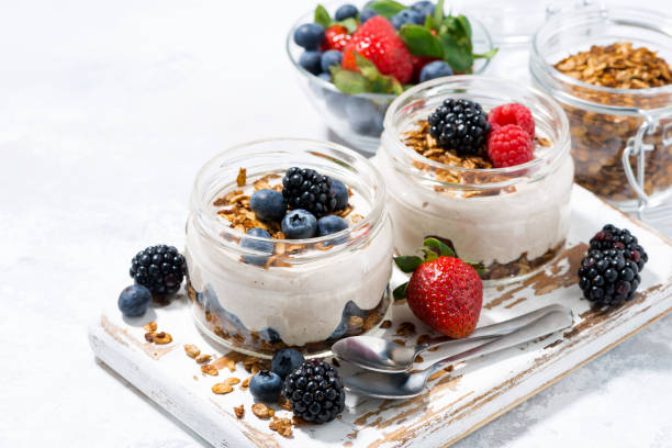istock healthy creamy dessert with fresh berries on white board 814564686
