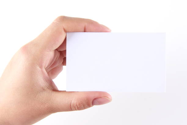 istock Female hand holding blank business card 814567462