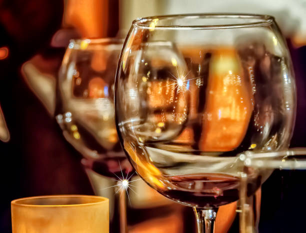 Close up of wine goblets glasses in romantic ambience