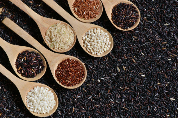 istock Top view different rice on wooden scoop with black riceberry 814567840