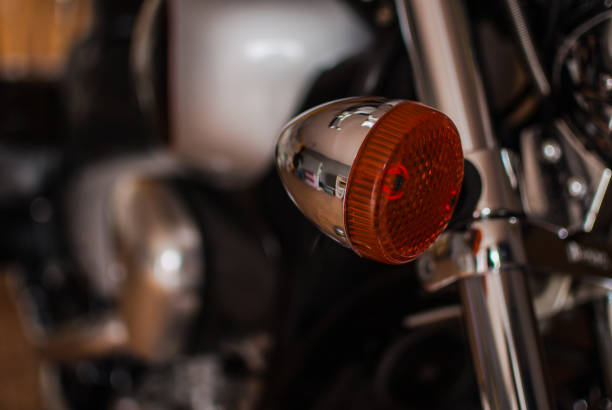 istock Closeup of chopper's chrome turn signals 814568076