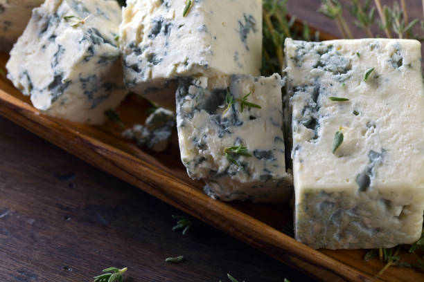 istock Blue cheese on a wooden table . 814576910