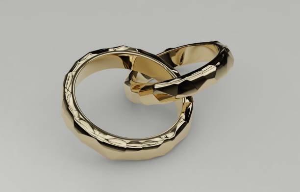 istock Two golden wedding rings intersected together isolated on white background, voronoi style. Symbol for marriage, love, relationships, proposals, valentine's day, engagement 3d illustration 814576974
