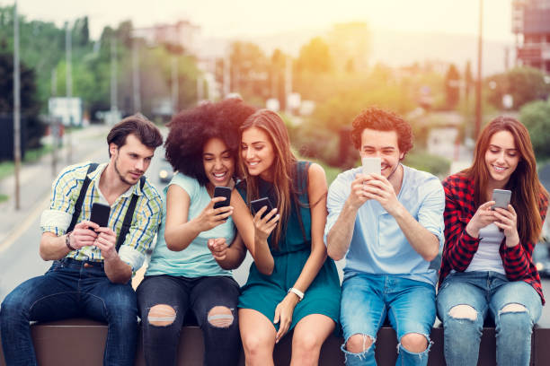 istock Young people at the bridge texting on their smartphones 814585226