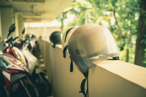 istock Motorcycles with Motorcycle helmets on the wall in builder. Safety concept. 814585340