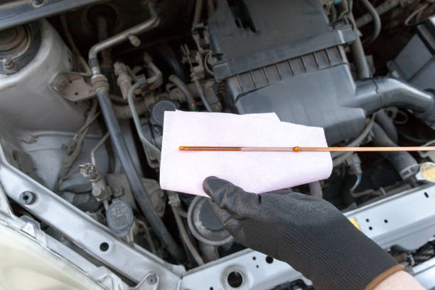 istock Checking motor oil level in the car. New engine lubricant. 814590326