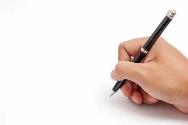 Photo of hand holding the pen