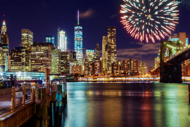 istock Firework over city at night with reflection in water 814599388
