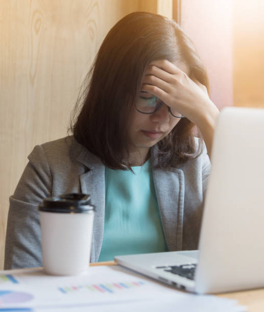istock Business woman having headache from overtime working. 814604810