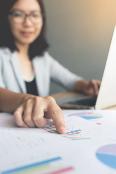 istock Business woman with Graph financial diagram documents. 814604812