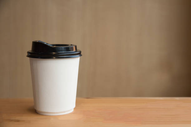 istock A cup of hot coffee on wooden background. 814604826