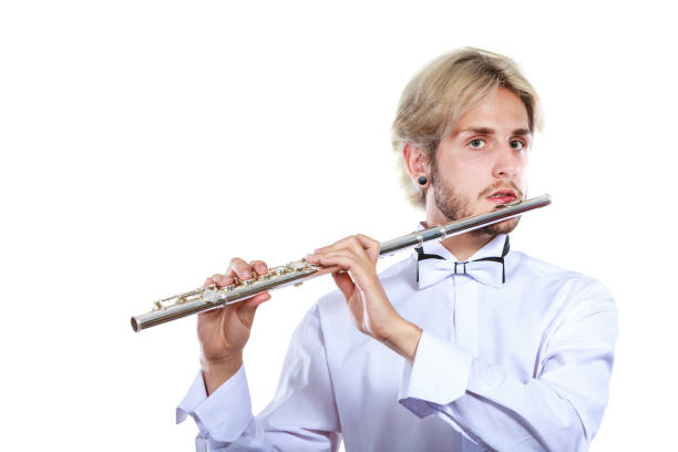 istock Male flutist playing his flute 814608216