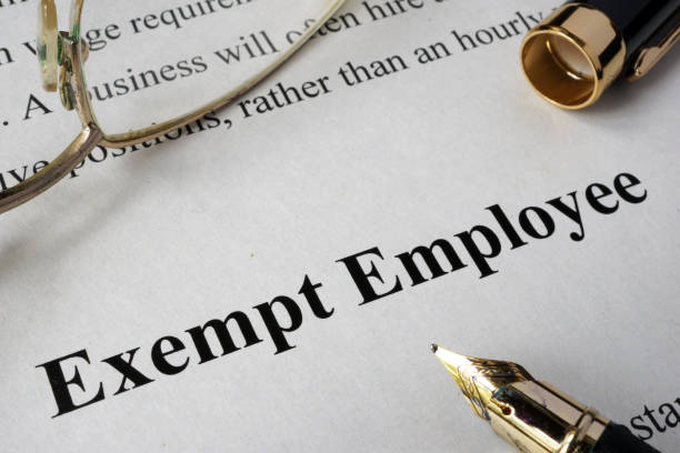 istock Exempt employee concept written on a paper. 814622952