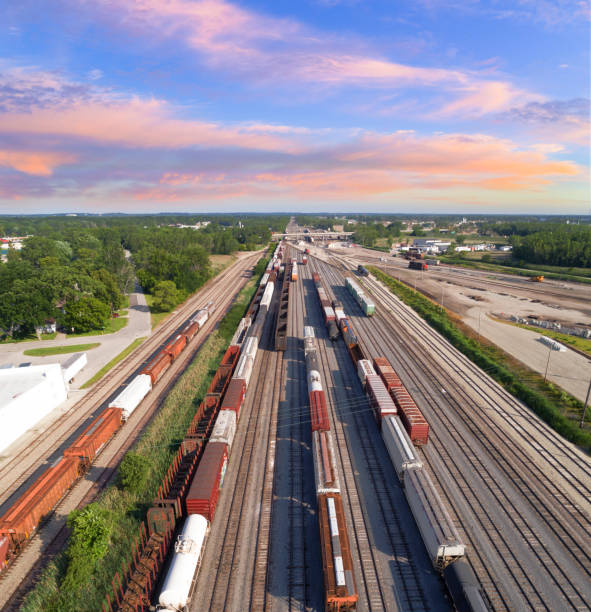 aerial view of railroad rail yard, many trains, tracks. Dynamic aerial view of industrial railroad rail train yard, many trains, tracks. shunting yard stock pictures, royalty-free photos & images