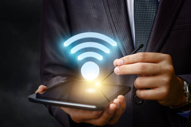 istock Businessman shows a WiFi symbol . 814637096