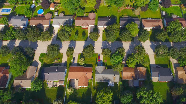 istock Looking down on nice neighborhoods on sunny Summer morning 814641700